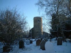 View of yaxham church in winter